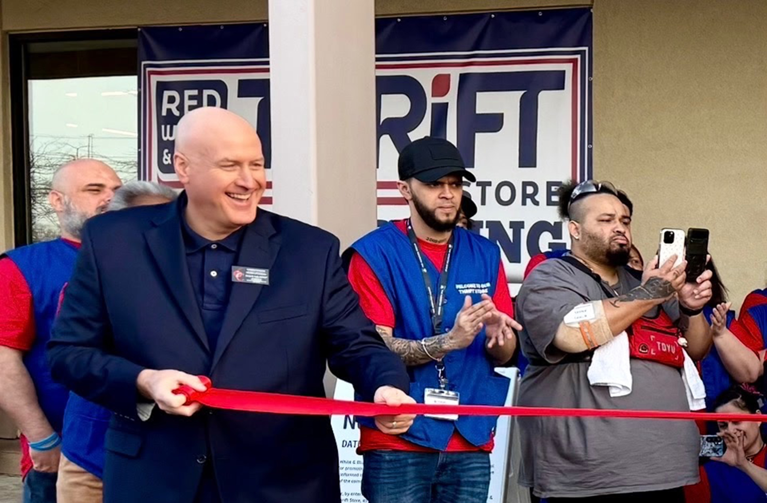 Ribbon cutting ceremony at a Red White & Blue Thrift Store location`
